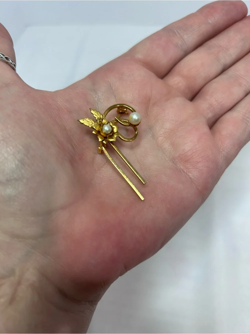 Delicate gold tone flower pin